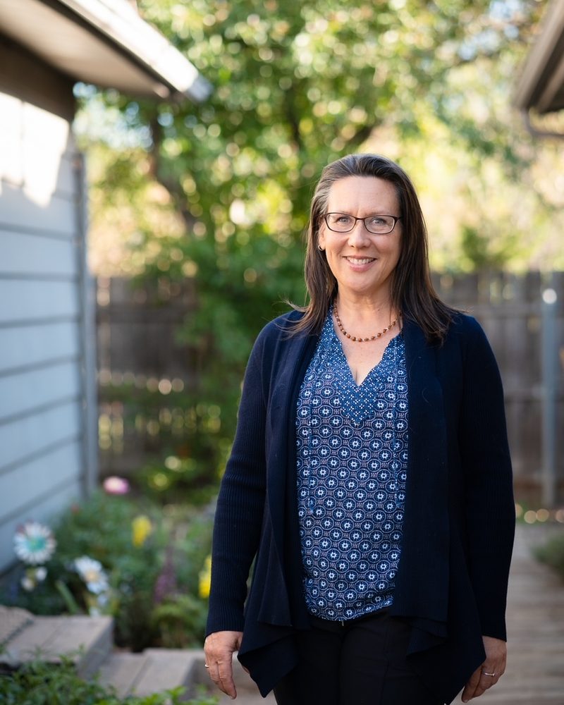 Aileen Judson standing in her garden